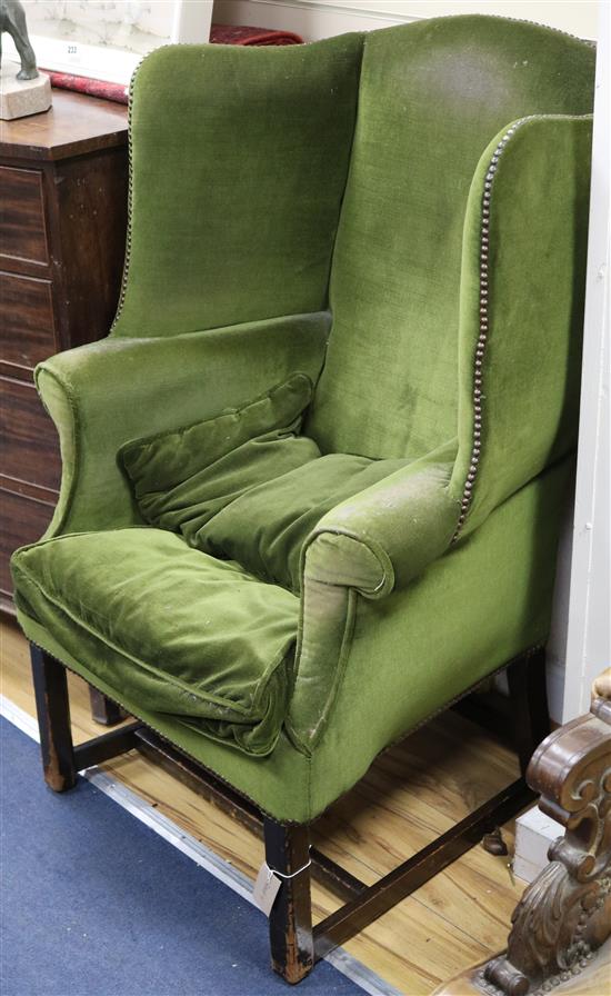 A Georgian style mahogany wing armchair